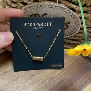 COACH Gold Cylinder Signature Pendant Necklace